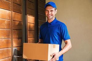 Cheerful delivery man. photo