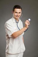 Cheerful doctor posing with a stethoscope
