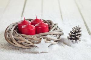 Wreath, red candles, wooden star, fir cone, copy space