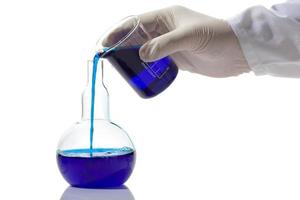Lab worker mixing chemicals photo
