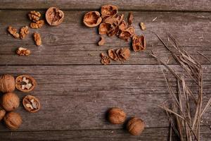 Walnuts on rustic wooden board background copy space for text photo