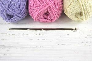 Yarn Wool pastel colours with crochet hook and copy space photo