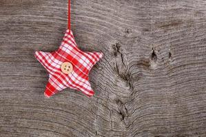 Red Fabric Star Merry Christmas Decoration Rustic Wood Backgroun photo