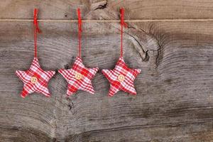 Red Fabric Star Merry Christmas Decoration Rustic Wood Backgroun photo