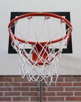 Basket in a old school gym photo