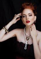 beauty stylish redhead woman with hairstyle and manicure wearing photo