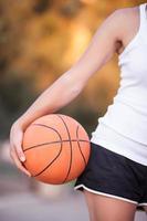 girl with a basketball ball photo