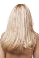 A picture of the back of a girl with long blonde hair