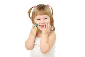little girl bedaubed with bright colors photo