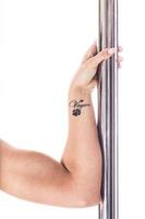 Hand of young vegan pole dancer photo
