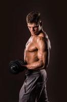 bodybuilder man holding weights photo