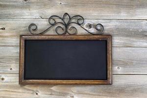 Traditional empty chalkboard on aged wood