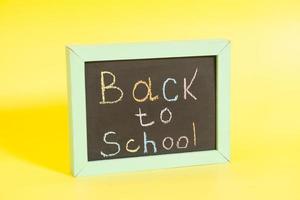 Back to School written on a chalkboard photo