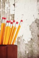 Yellow pencils in pencil holder photo