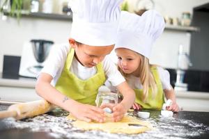 young kids happy childrens family preparing funny cake kitchen home