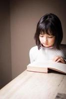 Girl reading studying book