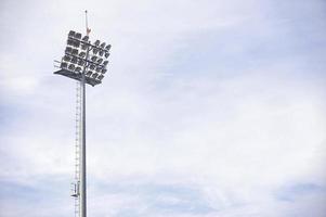 Stadium spotlights on daytime photo
