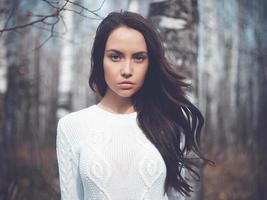 Beautiful lady in a birch forest photo