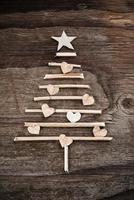 Christmas tree made of wooden branches photo