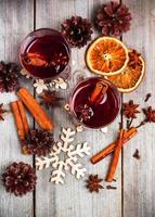 Christmas mulled wine on a rustic wooden table photo