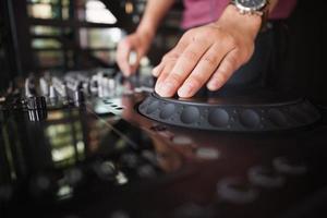 Close up of hands spinning the decks photo