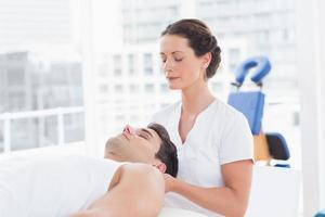 Man receiving neck massage photo
