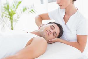 Man receiving neck massage photo
