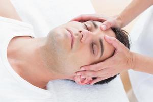 Man receiving head massage photo