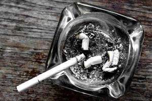 Cigarette and ashtray photo