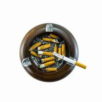 Top view of burning cigarette in ashtray photo