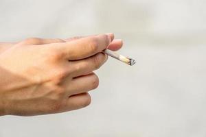 Hand with Rolled Cigarette or Joint