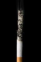 burning cigarette with skulls and ash