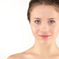 Front portrait of young adult woman with clean fresh skin photo