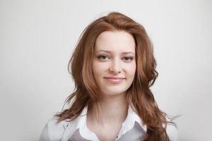 Smiling woman in white blouse, portrait photo