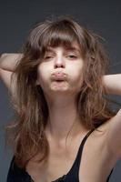 Young Woman with Brown Hair Making a Face photo