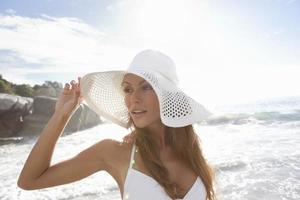 Woman wearing sunhat on beach