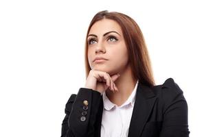 Businesswoman thinking with hand on chin photo