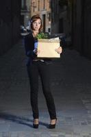 young jobless business woman fired from work on street photo