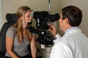 Eye Doctor with young patient photo