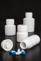 prescription medicine - blue and white capsules photo