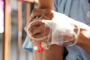 IV solution in patient hand photo