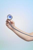 nurse hand holding stethoscope