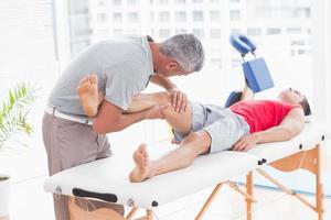 Man having leg massage photo
