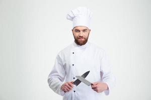 Happy male chef cook sharpening knife photo