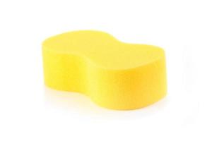 Sponge over white background. Yellow household cleaning spong photo