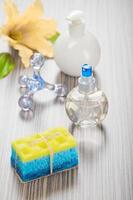 massager sponge soap flower and bottles photo