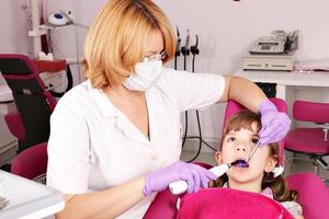 little girl patient and dentist photo