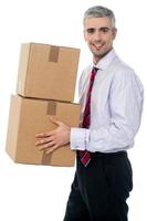Corporate man with a cardboard box in hand photo