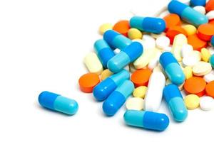 colorful pills on white background photo