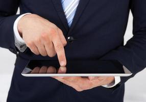Businessman Using Digital Tablet In Office photo
